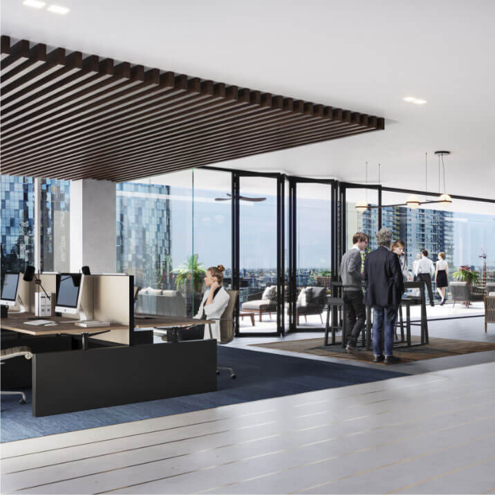 Open concept office with shared workstations and standing room