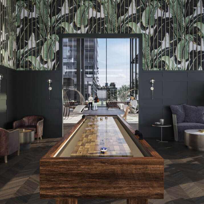 Carpeted lounge area with tabletop shuffleboard